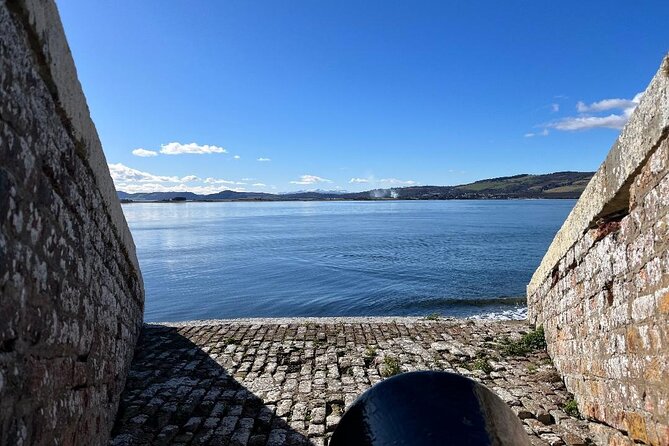 Invergordon Private Tour: Fort George, Cawdor Castle & Loch Ness - Dores Beach gives Loch Ness a quieter face